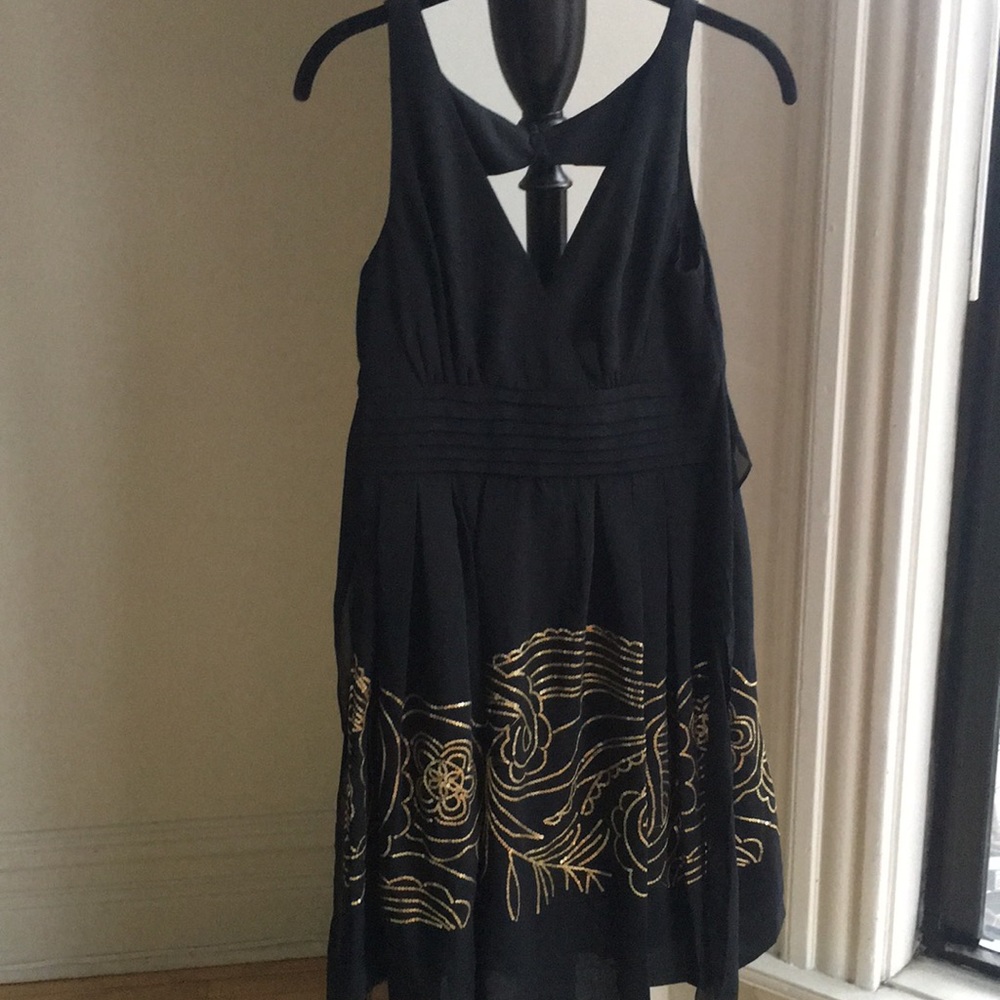 Black surplice neck gold sequin dress